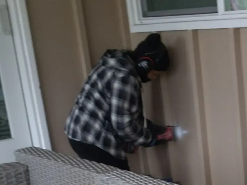 Professional electrician installing an exterior outlet in Burnet